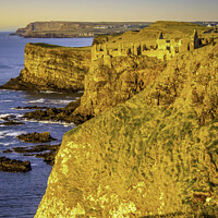 Buy canvas prints of Majestic Dunluce Castle in the Golden Hour by David McFarland