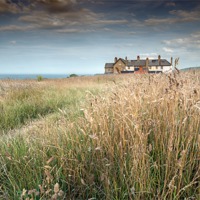 Buy canvas prints of Clifftop houses at Weybourne by Stephen Mole