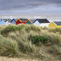 Buy canvas prints of Colourful Beach Huts by James Rowland