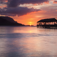 Buy canvas prints of Hanelei Pier Sunset by Mike Dawson