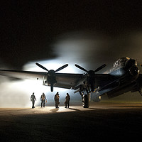 Buy canvas prints of Lancaster with air crew at night by Charlie Gray LRPS