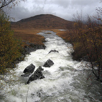 Buy canvas prints of Rapid river through Scottish Highlands by Dave Wyllie