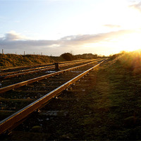 Buy canvas prints of Railway at Sunset by John Russell