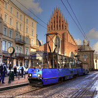 Buy canvas prints of Krakow tram and church  by Rob Hawkins