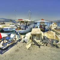 Buy canvas prints of Bike & Boats at Nafplion Harbour by Rob Hawkins