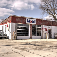 Buy canvas prints of Mobil Car by Rob Hawkins
