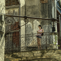 Buy canvas prints of  The Girl on the Balcony  by Rob Hawkins