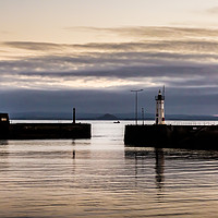 Buy canvas prints of Anstruther Harbour lighthouse at sunset  by Douglas Kerr