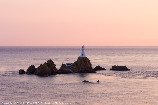 La Corbière lighthouse at sunset, Jersey. Picture Board by Douglas Kerr