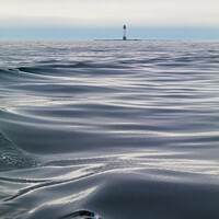 Buy canvas prints of Bell Rock Lighthouse across the waves by Douglas Kerr