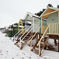 Buy canvas prints of Snowy Wells Beach Huts 2 by Paul Macro