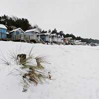 Buy canvas prints of Snowy Wells Beach Huts by Paul Macro