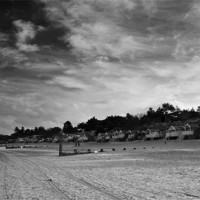 Buy canvas prints of Clouds over the Huts Two Mono by Paul Macro