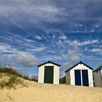 Buy canvas prints of Clouds over Southwold Beach Huts by Paul Macro