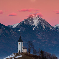 Buy canvas prints of Full moon rising over Jamnik church and Storzic at sunset by Ian Middleton