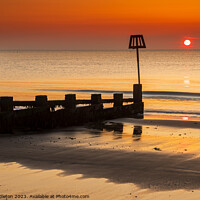 Buy canvas prints of Sunrise at Swanage Beach by Ian Middleton