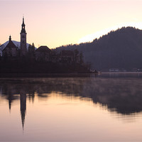 Buy canvas prints of Sunrise over Lake Bled by Ian Middleton