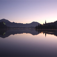 Buy canvas prints of Dawn breaks over Lake Bled by Ian Middleton