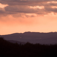 Buy canvas prints of Mountain sunset by Ian Middleton