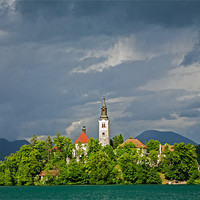 Buy canvas prints of Storm light over Lake Bled by Ian Middleton