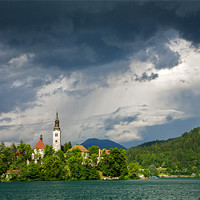 Buy canvas prints of Storm light over Lake Bled by Ian Middleton