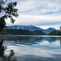 Buy canvas prints of After storm light over Lake Bled by Ian Middleton