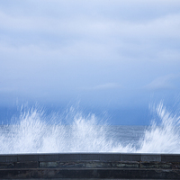 Buy canvas prints of Waves crashing over seawall in Scarborough by Ian Middleton