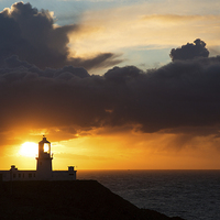 Buy canvas prints of Sunset at Strumble Head Lighthouse by Ian Middleton