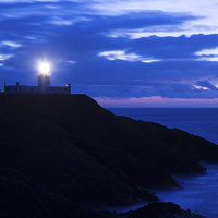 Buy canvas prints of Strumble Head Lighthouse at dusk by Ian Middleton