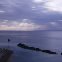 Buy canvas prints of Moonlight over Man of War Bay  by Ian Middleton