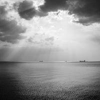 Buy canvas prints of Sunrays scattered by clouds over Trieste Bay by Ian Middleton