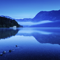 Buy canvas prints of Dawn at Lake Bohinj in Slovenia by Ian Middleton