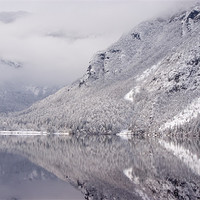 Buy canvas prints of Wintery reflections of Bohinj by Ian Middleton