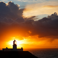 Buy canvas prints of Sunset at Strumble Head Lighthouse by Ian Middleton
