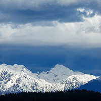 Buy canvas prints of Fresh snow on the Kamnik Alps by Ian Middleton