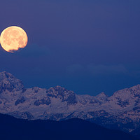 Buy canvas prints of Moonset over the Julian Alps by Ian Middleton