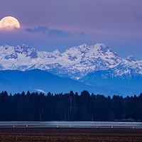 Buy canvas prints of Full Moon setting over the Julian Alps by Ian Middleton
