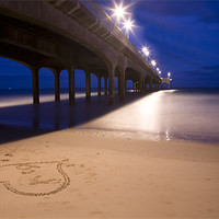 Buy canvas prints of Love heart in the sand at Boscombe Pier by Ian Middleton