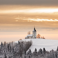 Buy canvas prints of Winter sunrise at Jamnik church of Saints Primus a by Ian Middleton
