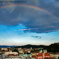 Buy canvas prints of Rainbow over Ljubljana by Ian Middleton
