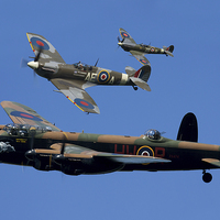 Buy canvas prints of Lancaster Bomber and Spitfires by Oxon Images