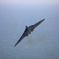 Buy canvas prints of Vulcan XH558 Beachy headflypast by Oxon Images
