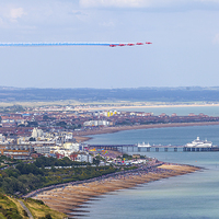 Buy canvas prints of  Red Arrows arrival over Eastbourne by Oxon Images