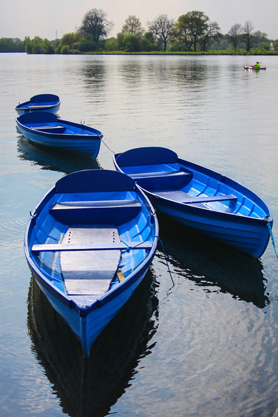 Blue boats on a lake Picture Board by Oxon Images