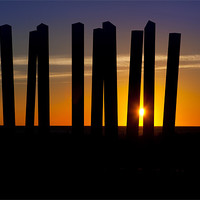 Buy canvas prints of Sunrise through a sculpture. by David Hare