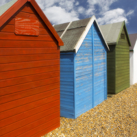 Buy canvas prints of   Multi-coloured beach Huts by David Hare
