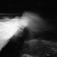 Buy canvas prints of waves smashing over harbour wall by jon betts