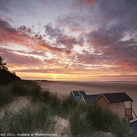 Buy canvas prints of Sunset, beach huts and dunes at Wells-next-the-sea. Norfolk, UK. by Liam Grant
