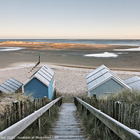 Buy canvas prints of Frost covered beach huts on a winter's morning. Wells-next-the-sea, Norfolk, UK. by Liam Grant