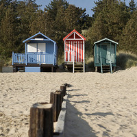 Buy canvas prints of Beach huts and blue sky. Wells-next-the-sea. by Liam Grant